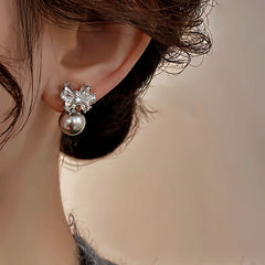 Angled view of the 14K Gold-Plated Elegant Zircon Bow Pearl Earrings