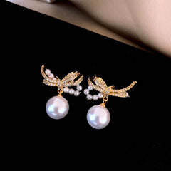 Close-up detail of the sparkling zircons and plating on the Bow Pearl Earrings