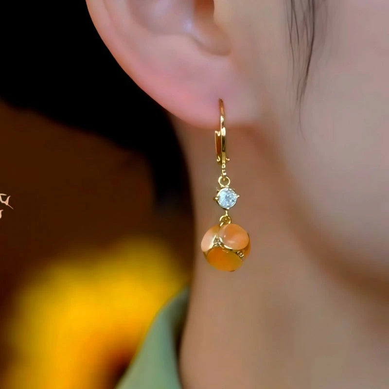 Close-up detail of the sparkling zircons and plating on the Brown Cat's Eye Earrings