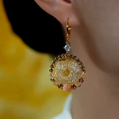 Close-up detail of the sparkling zircons and plating on the Brown Cat's Eye Earrings