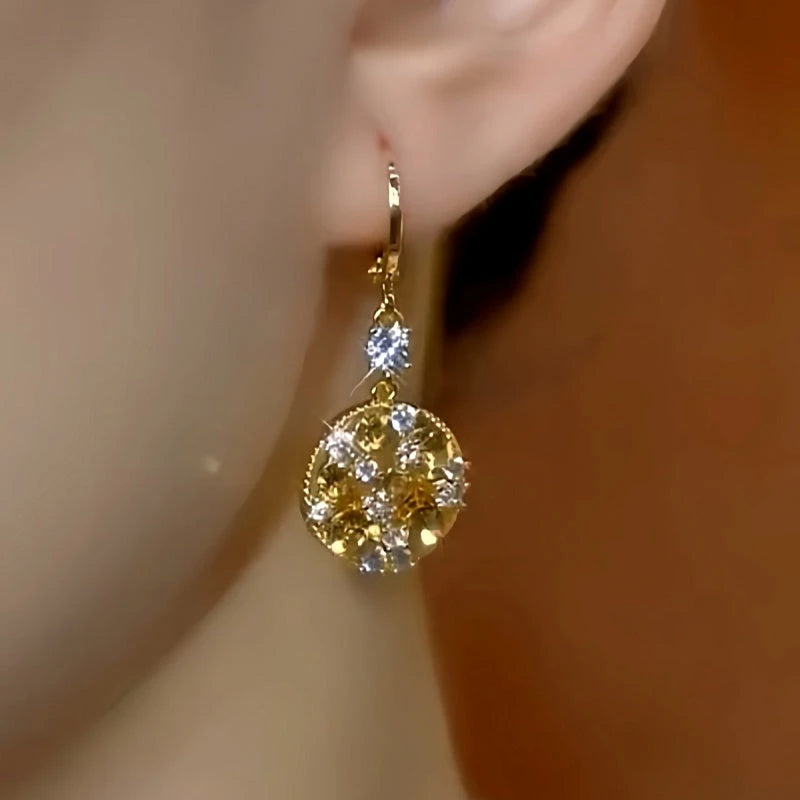 Close-up detail of the sparkling zircons and plating on the Brown Drop Earrings