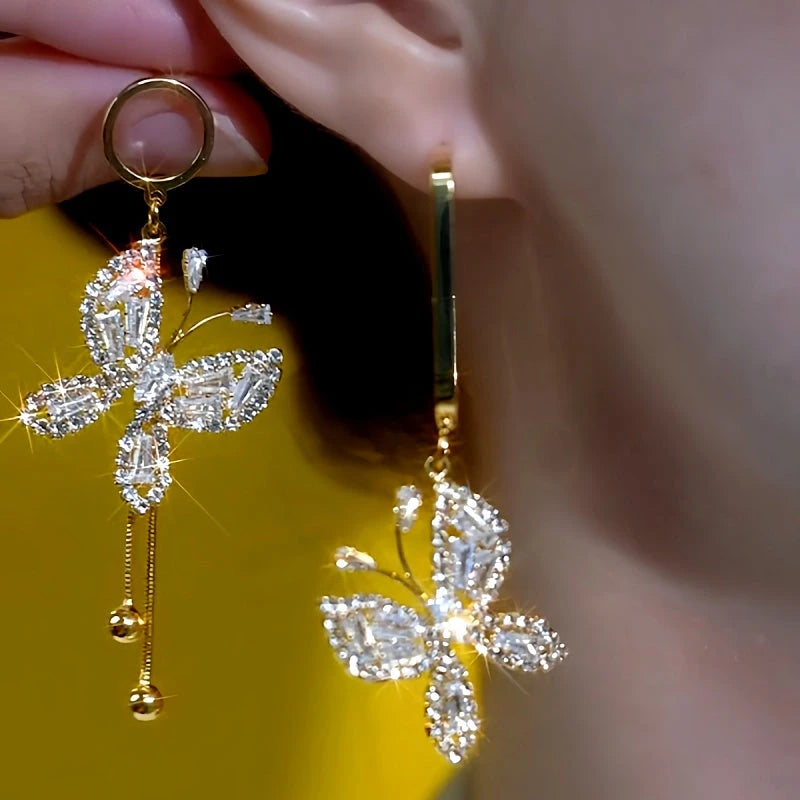 Close-up detail of the sparkling zircons and plating on the Asymmetrical Butterfly Earrings