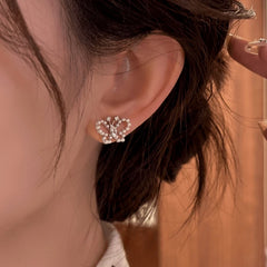 Model showcasing the dangle and style of the 14K Gold-Plated Elegant Zircon Butterfly Bead Stud Earrings