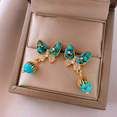 Angled view of the 14K Gold-Plated Elegant Zircon Butterfly Bohemian Earrings