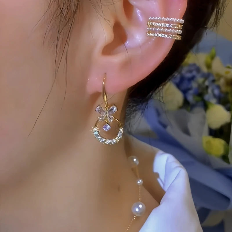 Model showcasing the dangle and style of the 14K Gold-Plated Elegant Zircon Butterfly Ear Hooks