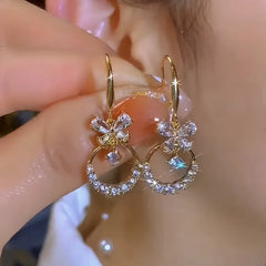 Angled view of the 14K Gold-Plated Elegant Zircon Butterfly Ear Hooks