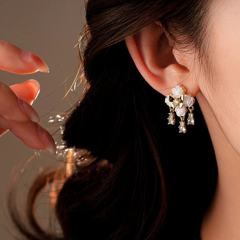 Model showcasing the dangle and style of the 14K Gold-Plated Elegant Zircon Butterfly Earrings