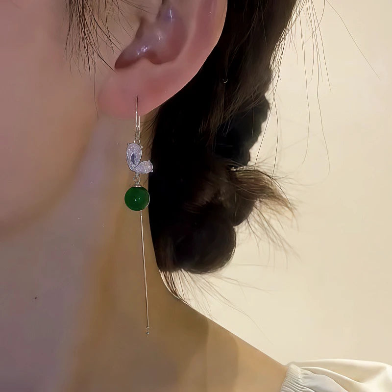 Close-up detail of the sparkling zircons and plating on the Butterfly Threader Earrings