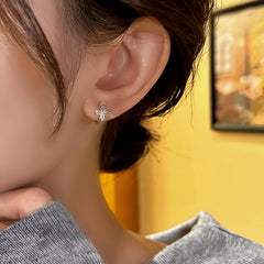 Model showcasing the dangle and style of the 14K Gold-Plated Elegant Zircon Butterfly Hoop Earrings