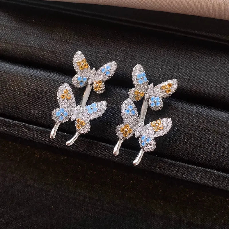 Angled view of the 14K Gold-Plated Elegant Zircon Butterfly Jacket Earrings