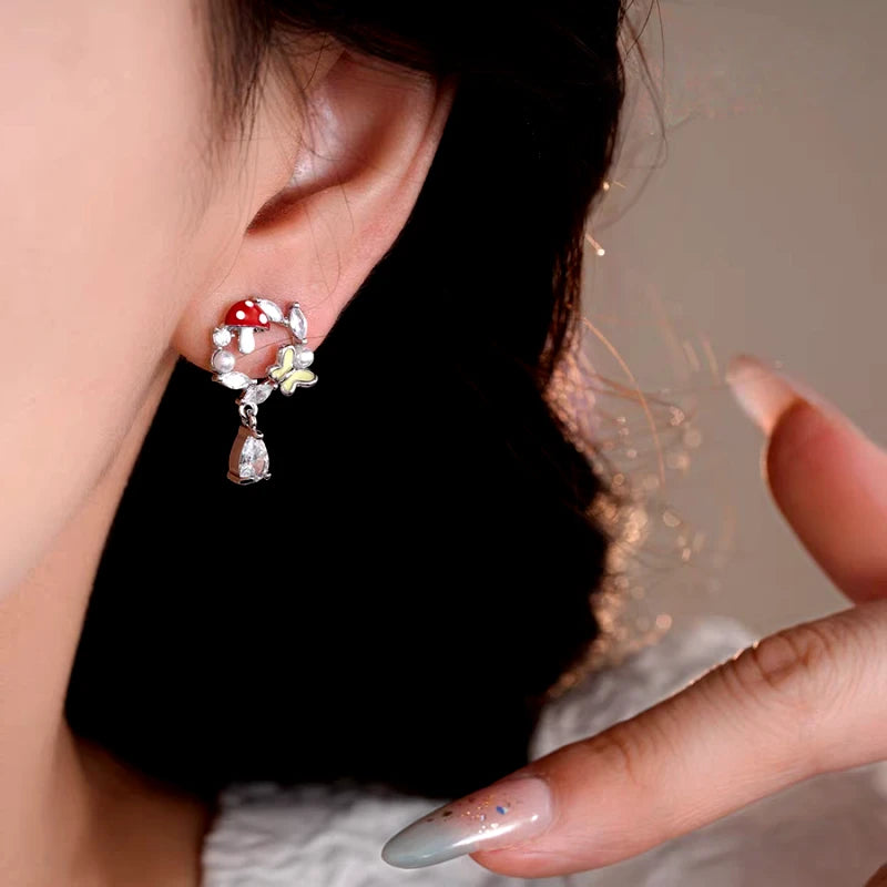 Model showcasing the dangle and style of the 14K Gold-Plated Elegant Zircon Butterfly Mushroom Earrings