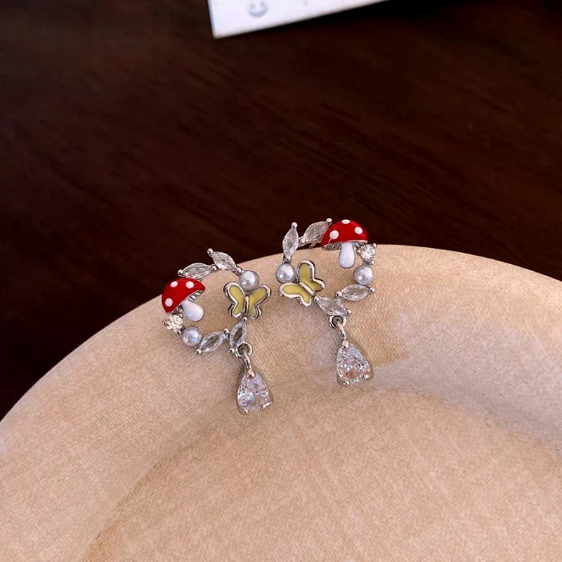 Close-up detail of the sparkling zircons and plating on the Mushroom Earrings