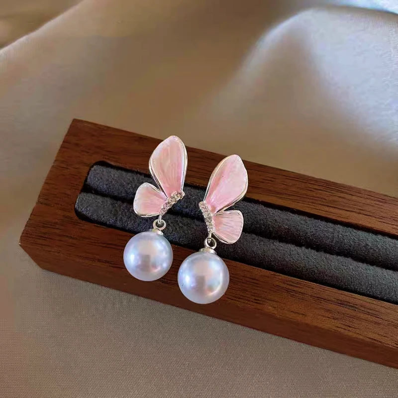 Angled view of the 14K Gold-Plated Elegant Zircon Butterfly Pearl Earrings