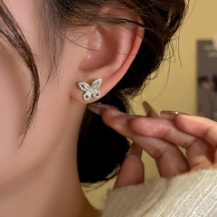 Model showcasing the dangle and style of the 14K Gold-Plated Elegant Zircon Butterfly Stud Earrings