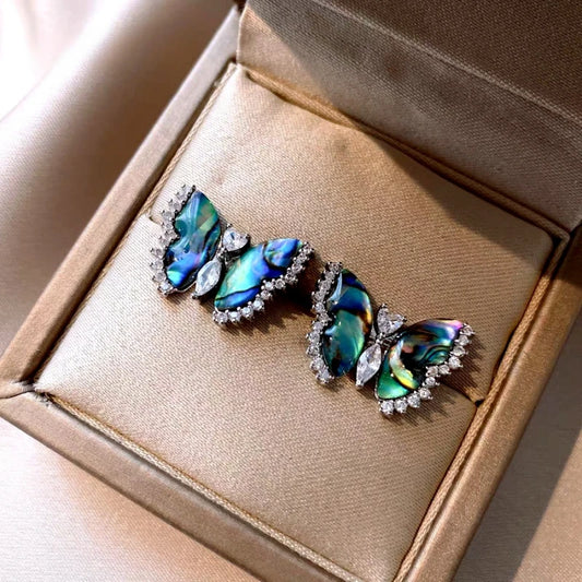 Model showcasing the dangle and style of the 14K Gold-Plated Elegant Zircon Butterfly Stud Earrings