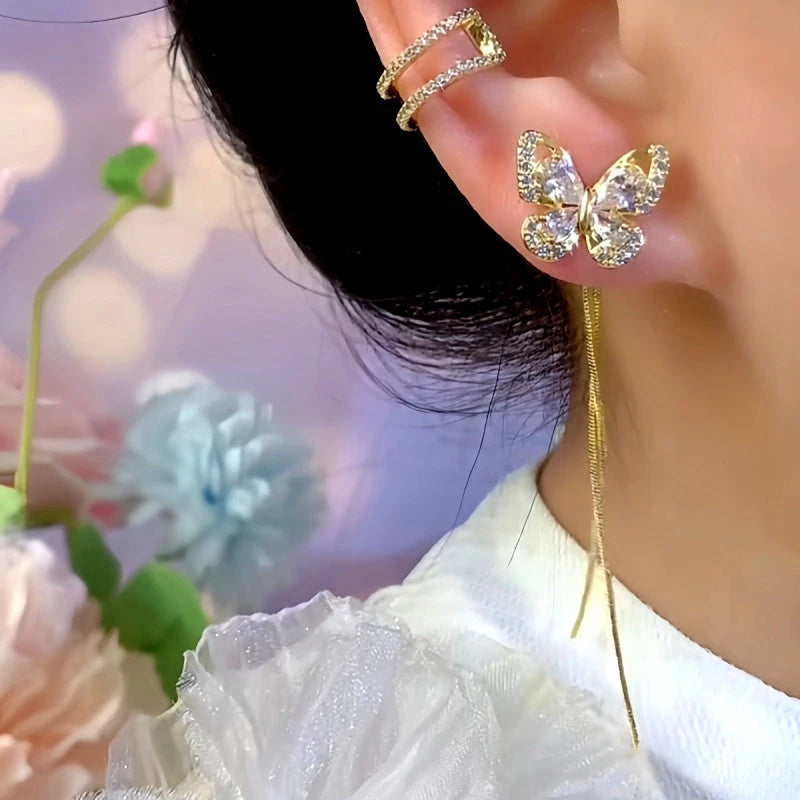 Model showcasing the dangle and style of the 14K Gold-Plated Elegant Zircon Butterfly Tassel Earrings