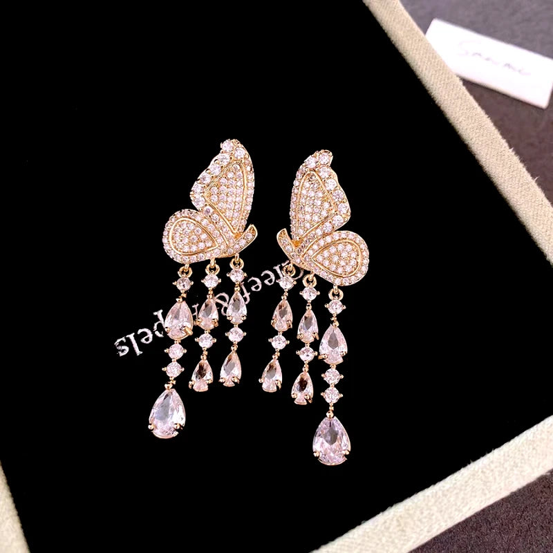 Angled view of the 14K Gold-Plated Elegant Zircon Butterfly Tassel Earrings