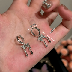 Angled view of the 14K Gold-Plated Elegant Zircon Butterfly Tassel Earrings