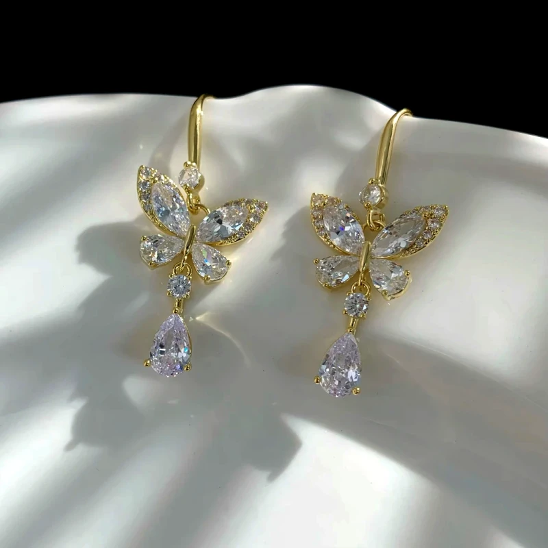 Angled view of the 14K Gold-Plated Elegant Zircon Butterfly Water Drop Ear Hook Earrings