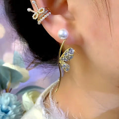 Model showcasing the dangle and style of the 14K Gold-Plated Elegant Zircon Butterfly Wing Pearl Earrings