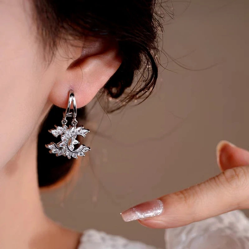 Close-up detail of the sparkling zircons and plating on the C-Shaped Earrings