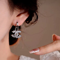 Close-up detail of the sparkling zircons and plating on the C-Shaped Earrings