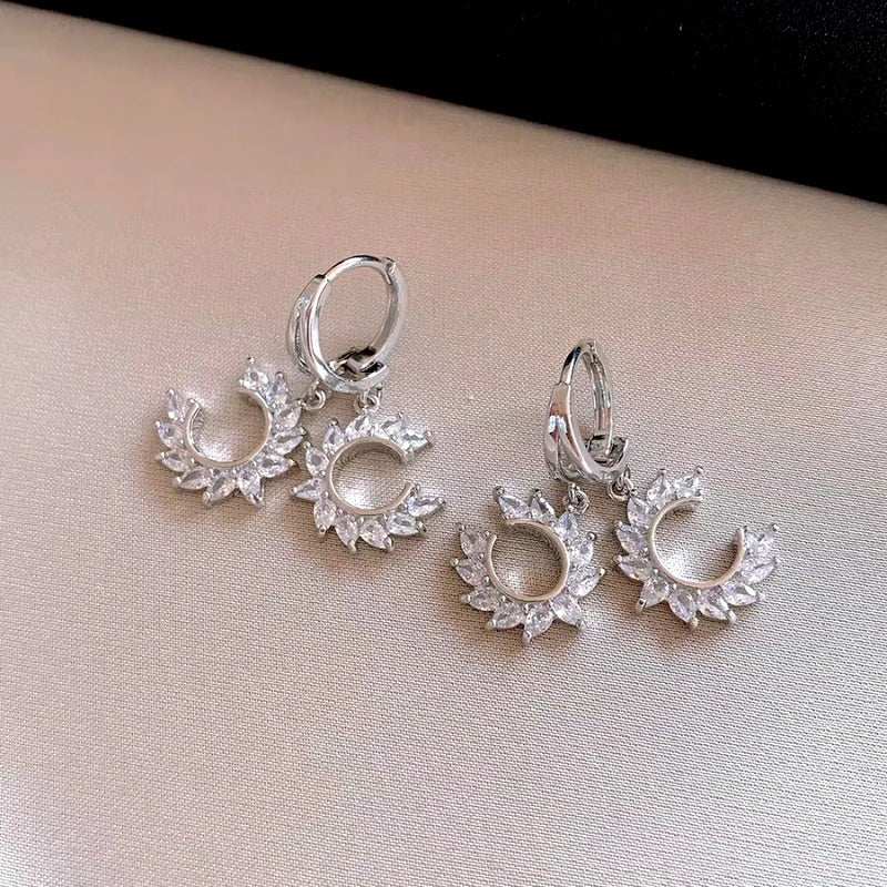 Angled view of the 14K Gold-Plated Elegant Zircon C-Shaped Earrings