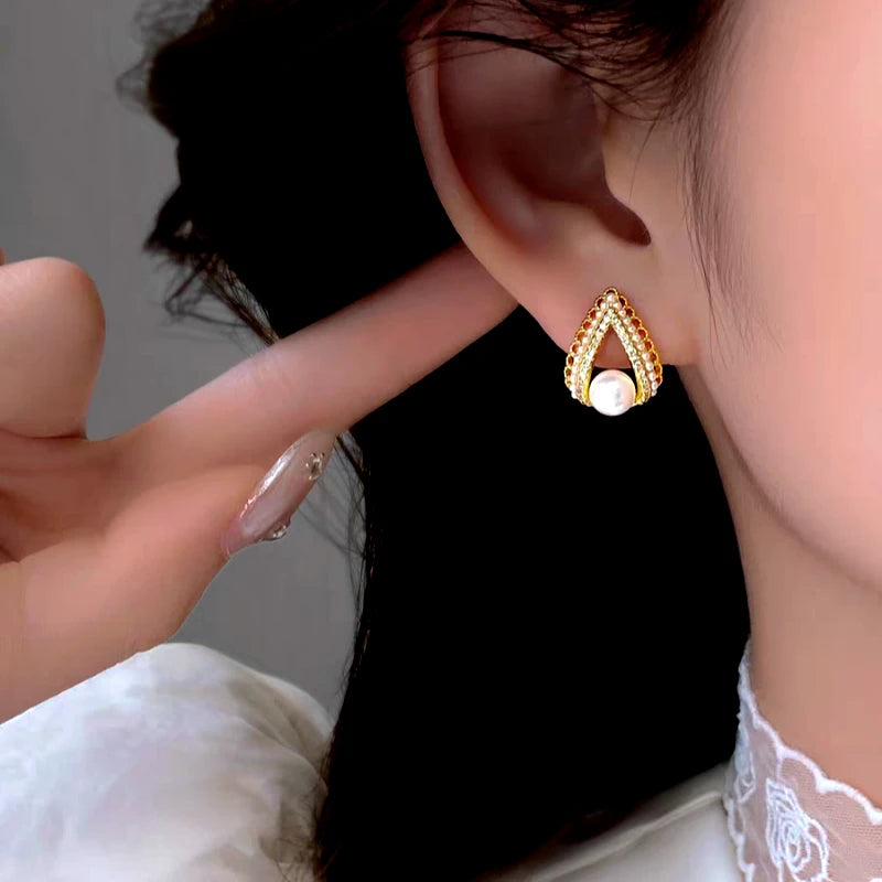 Close-up detail of the sparkling zircons and plating on the Pearl Hoop Earrings