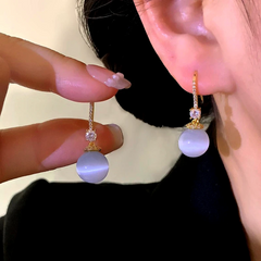 Angled view of the 14K Gold-Plated Elegant Zircon Cat's Eye Bead Earrings