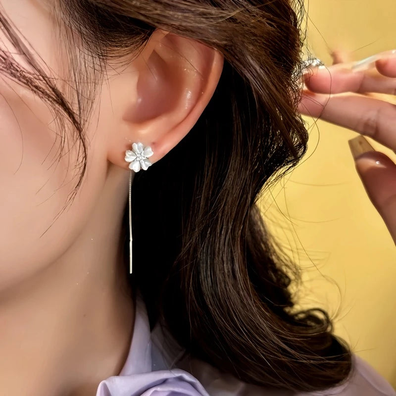 Close-up detail of the sparkling zircons and plating on the Cat's Eye Flower Threaders