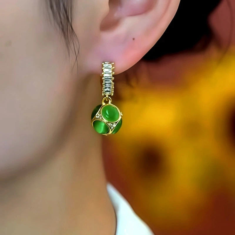 Close-up detail of the sparkling zircons and plating on the Green Cat's Eye Earrings