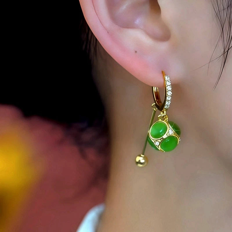 Close-up detail of the sparkling zircons and plating on the Cat's Eye Tassel Earrings