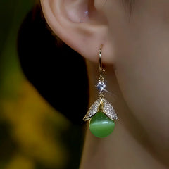 Close-up detail of the sparkling zircons and plating on the Green Cat's Eye Earrings