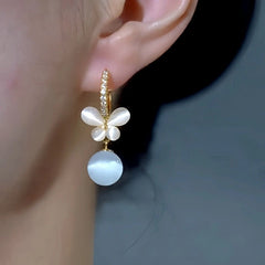 Close-up detail of the sparkling zircons and plating on the Cat's Eye Butterfly Earrings