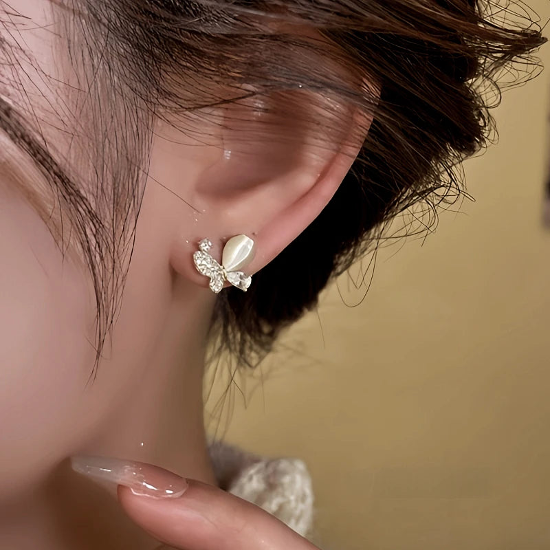 Close-up detail of the sparkling zircons and plating on the Cat's Eye Butterfly Studs