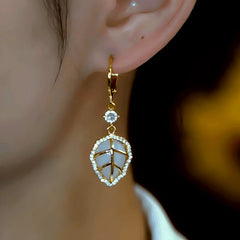 Close-up detail of the sparkling zircons and plating on the Gold Leaf Earrings
