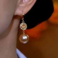 Close-up detail of the sparkling zircons and plating on the Pearl Drop Earrings