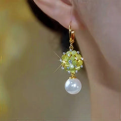 Close-up detail of the sparkling zircons and plating on the Pearl Dangle Earrings