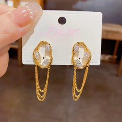 Angled view of the 14K Gold-Plated Elegant Zircon Chain Tassel Earrings