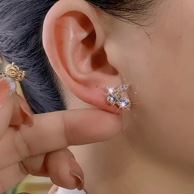Close-up detail of the sparkling zircons and plating on the Cherry Stud Earrings
