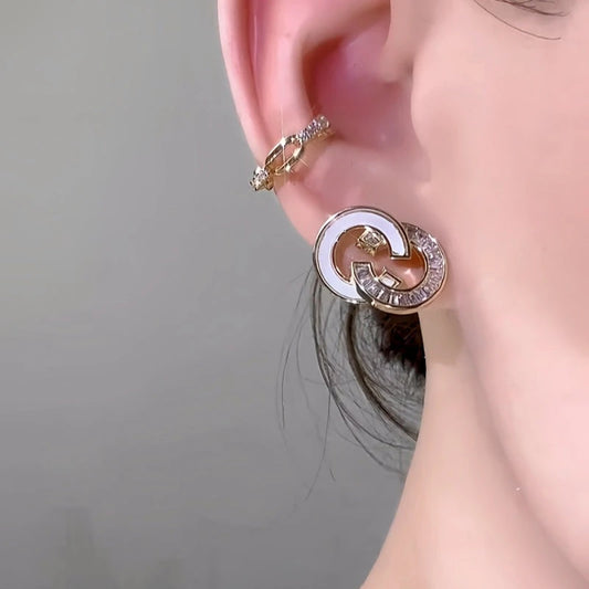 Model showcasing the dangle and style of the 14K Gold-Plated Elegant Zircon Classic Stud Earrings