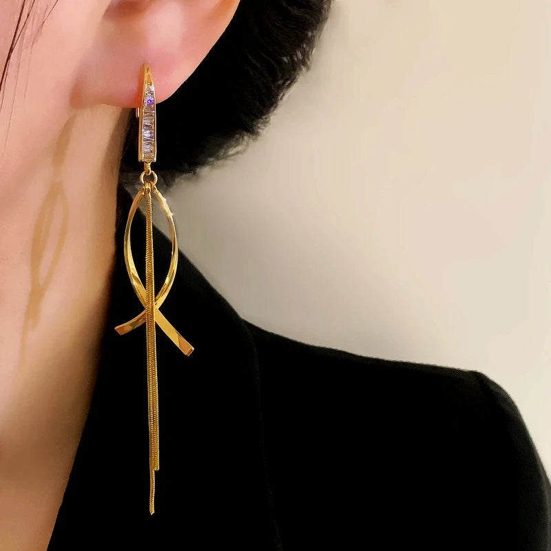 Close-up detail of the sparkling zircons and plating on the Cross Tassel Earrings