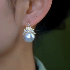 Close-up detail of the sparkling zircons and plating on the Crown Pearl Earrings