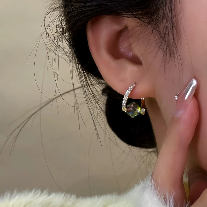 Close-up detail of the sparkling zircons and plating on the Crystal Dangle Earrings