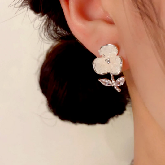 Model showcasing the dangle and style of the 14K Gold-Plated Elegant Zircon Crystal Flower Earrings