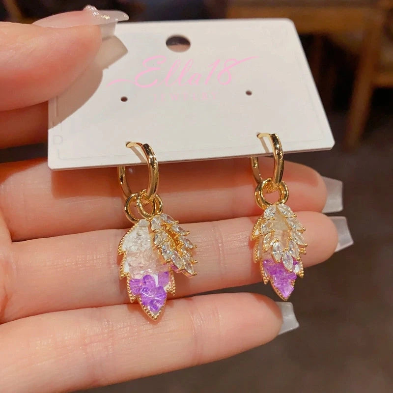 Close-up detail of the sparkling zircons and plating on the Purple Crystal Earrings