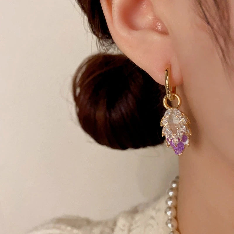 Model showcasing the dangle and style of the 14K Gold-Plated Elegant Zircon Crystal Leaf Earrings