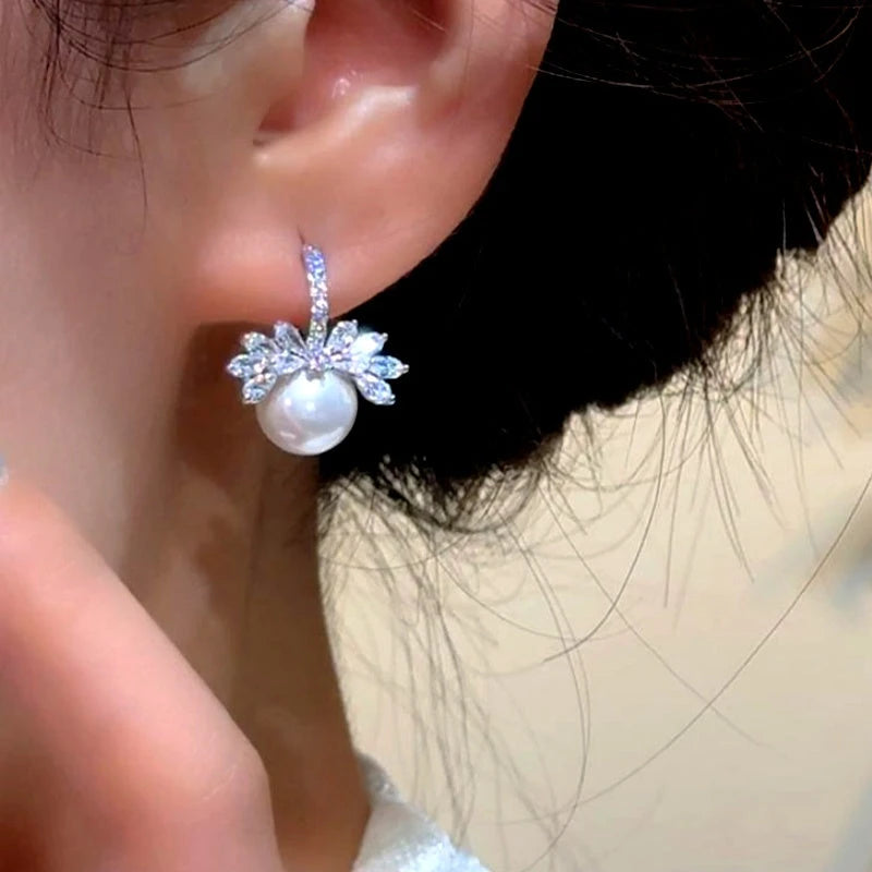 Close-up detail of the sparkling zircons and plating on the Pearl Earrings