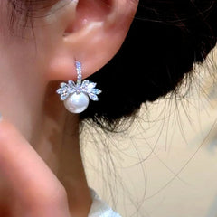 Close-up detail of the sparkling zircons and plating on the Pearl Earrings