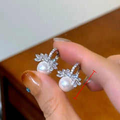 Angled view of the 14K Gold-Plated Elegant Zircon DIamond Bead Pearl Earrings
